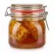 Glass jar of Hasbal syrup with visible honeycomb inside