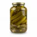 Close-up side view of pickled cucumbers in glass jar