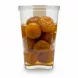 Container of golden plums in syrup held in hand