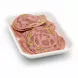 Slices of Demes beef and chicken salami with pistachio nuts placed in a white tray