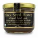 Jar of River of Honey Black Seed Honey with black and gold label