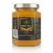 Jar of Farmer Direct honey with organic turmeric showing label front