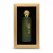 Green frosted glass perfume bottle with gold embellished cap inside a presentation box