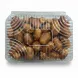 Hand holding clear plastic tray of fresh Zahedi dates in store aisle