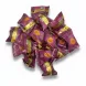 Individually wrapped Alalain Dates Maamoul sweets pile on desk