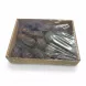 Close-up view of Medjool dates in transparent tray inside box