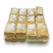 Close-up of Halalo layered Napoleon Mille-Feuille squares sprinkled with powdered sugar