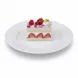 Single slice of rich berry delight cake with fresh strawberries and whipped cream on a white plate