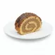 Slice of chocolate swirl cake roll on a white plate showing creamy filling