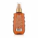 Garnier Ambre Solaire Ideal Bronze tan enhancing oil bottle back with ingredients and usage