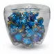 Transparent container full of individually wrapped assorted chocolates
