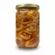 Side view showing jar filled with pickled aubergines stuffed with walnuts and spices