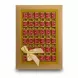 Gold box of individually wrapped Achaachi chocolates with satin bow