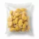 Close-up view of frozen crispy breaded chicken nuggets in sealed transparent bag