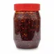 Close-up view of extra hot chilli oil with visible chilli flakes inside jar