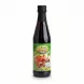 Bottle of Al-Rabih pomegranate molasses held in hand showing front label