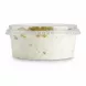 Side view of 4 Seasons Traditional Pistachio Ice Cream tub showing texture