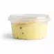 Side view of 4 Seasons saffron pistachio wafer ice cream in plastic container