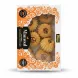 Box containing assorted Mamoul pastries with visible walnut, date and pistachio shapes