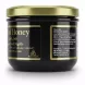 Side view of Black Seed Honey jar showing River of Honey brand and UK address