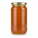 Clear golden multiflower honey in jar side view