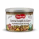 Enhanced Hand holding Bodrum Canned Lentils in Sauce 400g tin in a grocery store