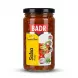 Enhanced Front view of Badr Pickled Salsa 370g jar held in hand with vegetables illustration