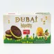 A professional 1:1 e-commerce photo of the Sweet Plus Dubai Pistachio Biscuits box. The box, which is clean and free of labels, is centered on a white background and lit with professional studio lighting. It features a decorative green and white design with illustrations of chocolate pistachio biscuits, kadatif, and a Dubai skyline motif.