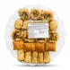 Enhanced Sweetland Premium Pistachio Baklava Selection in clear platter with assorted baklava shapes and ingredients label visible