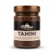 Enhanced Front view of Olympos Tahini with Cocoa jar held in hand