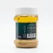 A 1:1 professional product photograph of a clear plastic jar of Akre Tahini Natural Sesame, featuring a dark green label with details including '350g', 'Made in Iraq Kurdistan', and a barcode. The jar is centered against a clean white background with a soft, even shadow.