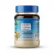 A clear glass jar of Cortas Tahina Natural paste, positioned for a professional e-commerce product shot with a blue lid and a visible label with distribution information.
