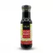 Enhanced A 150ml bottle of Malay Taste Kicap Manis Sweet Soy Sauce held by a hand. The glass bottle is filled with a dark sauce and has a black, white, and red label featuring green floral patterns and English text on a clean white background.