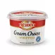 Enhanced Hand holding Président Whipped Cream Cheese tub in a grocery store