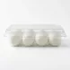 This is your transformed e-commerce product image and the requested SEO-friendly image alt-text. **ALT-TEXT**: A clean side-view photo of Melis Labneh Cheese Balls in a clear plastic container against a white background. It shows four smooth, white cheese balls arranged neatly inside.