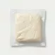 Enhanced Unwrapped Dairy Day halloumi cheese piece in vacuum-sealed pack