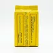 A professional, close-up photograph of the back of an El Arosa Black Kenyan Tea loose leaf 100g yellow foil pack. The product information, including English and Arabic text, and production details, are clearly displayed under perfect studio lighting.