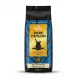 A 250g bag of Monzil Pure Ceylon Black Tea O.P.A is centered on a clean white background with a soft, equal shadow. The bag features vibrant blue and yellow branding, a teacup illustration, and text in a crisp, sharp focus.