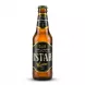 Enhanced Front view of Istak Non Alcoholic Malt Beverage bottle held in a shop aisle