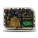 A 1:1 professional e-commerce product photograph of a clear plastic tub filled with premium Ajwa dates from Madinah Delight. The product is perfectly centered and fills 85% of the frame against a clean, white background, lit by soft, even studio lighting that creates subtle, symmetrical shadows. The detailed golden foil artwork, featuring a mosque and minaret, and the product text in English and Arabic are sharp and clear, with all price stickers and background elements removed.
