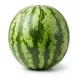 Enhanced Hand holding a large whole watermelon with green striped rind outside a fruit and vegetable shop