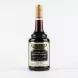 A 600ml glass bottle of Kassatly Chtaura Tamarind Syrup with its black and gold label, containing a dark amber liquid and sealed with a gold screw cap, isolated on a plain white background.
