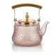 Enhanced Glass teapot with gold handle and lid on countertop