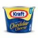 A 190g tub of Kraft Processed Cheddar Cheese is centrally positioned on a clean white background. It features the classic red and white Kraft logo above the product name in blue and gold lettering, under professional studio lighting.