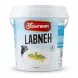 A 1kg plastic tub of Yasmeen Oriental Gourmet Labneh Arabic Strained Yoghurt, isolated on a white background with a soft shadow. The white label features a large cow illustration and a picture of labneh garnished with olive oil and mint.