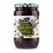 Front label of Greenfields Kalamata Olives 720g jar held in hand