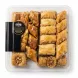 Close-up of flaky baklava pieces in Al Sultan mixed baklava selection tray with price label