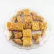 Platter of Hamadah Sultan baklava and semolina sweets with nut topping