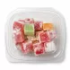 Plastic container filled with assorted colourful Turkish Delight cubes dusted with powdered sugar and an orange £3.99 price sticker