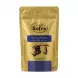 A 200g gold-foil stand-up pouch of Sofra Lebanese Blend Coffee with Medium Cardamom. The pack features Arabic text, a landscape illustration, and states "Roasted in London".